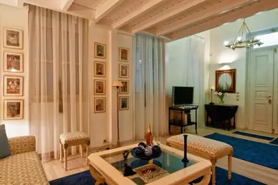 a living room with a couch and a table at Acropolis Luxury House in Athens