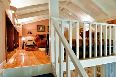 a room with a staircase leading to a bedroom at Acropolis Luxury House in Athens