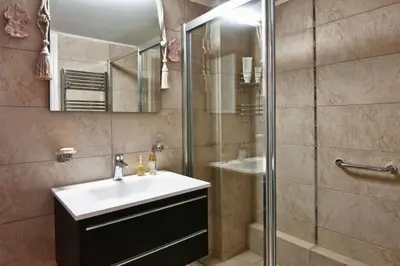 a bathroom with a sink and a shower at Acropolis Luxury House in Athens