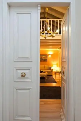 a door leading into a room with a living room at Acropolis Luxury House in Athens