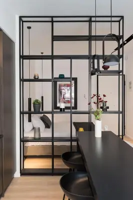 a room with a bed and a black shelf at Voda Luxury Residence #301 - Acropolis View Rooftop in Athens