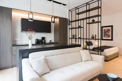 a living room with a white couch and a bed at Voda Luxury Residence #301 - Acropolis View Rooftop in Athens