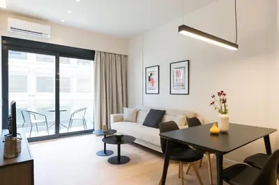 a living room with a couch and a table at Voda Luxury Residence #302 - Acropolis View Rooftop in Athens