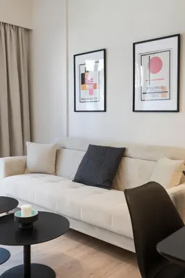 a living room with a couch and two tables at Voda Luxury Residence #302 - Acropolis View Rooftop in Athens