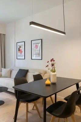 a living room with a table and a couch at Voda Luxury Residence #302 - Acropolis View Rooftop in Athens