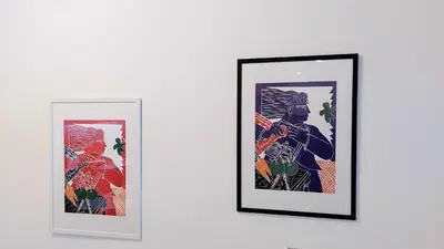 two framed pictures on a white wall at Wonderful apartment in Acropolis in Athens