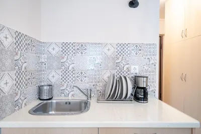 a kitchen with a sink and a counter top at Monastiraki metro st studio for 2 persons by MPS in Athens