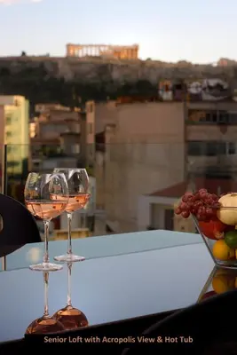 a pair of wine glasses sitting on a table at ATER ALBUS by K&K in Athens