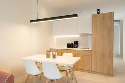 a kitchen with a white table and white chairs at Voda Luxury Residence #402 - Acropolis View Rooftop in Athens