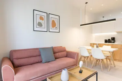 a living room with a couch and a table at Voda Luxury Residence #402 - Acropolis View Rooftop in Athens