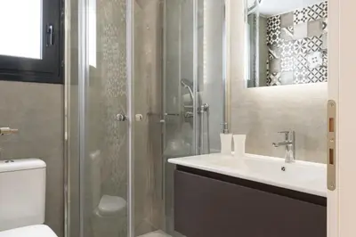 a bathroom with a sink and a shower at Voda Luxury Residence #402 - Acropolis View Rooftop in Athens