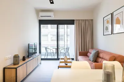 a living room with a couch and a table at Voda Luxury Residence #402 - Acropolis View Rooftop in Athens