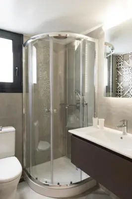 a bathroom with a shower and a sink and a toilet at Voda Luxury Residence #402 - Acropolis View Rooftop in Athens