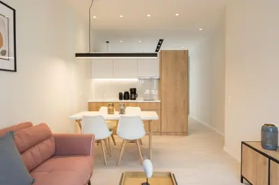 a living room with a couch and a table and chairs at Voda Luxury Residence #402 - Acropolis View Rooftop in Athens