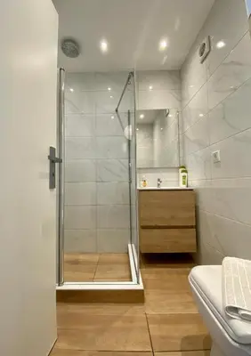 a bathroom with a shower and a sink at Mosaikon Guesthouses #Nikiou Str in Athens