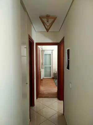 a hallway with a hallway leading to a room at Alimos seaview apartment in Athens