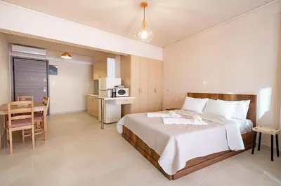 a hotel room with a bed and a table at Monastiraki metro station studio for 4 pers by MPS in Athens