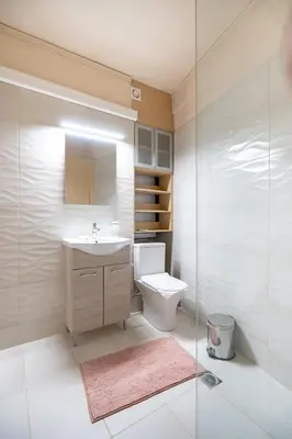 a bathroom with a toilet and a sink and a shower at Monastiraki metro station studio for 4 pers by MPS in Athens