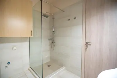 a shower with a glass door in a bathroom at Monastiraki metro station studio for 4 pers by MPS in Athens