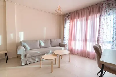 a living room with a couch and a table at Monastiraki metro station studio for 4 pers by MPS in Athens