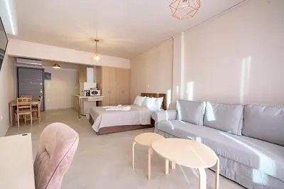 a living room with a couch and a bed at Monastiraki metro station studio for 4 pers by MPS in Athens