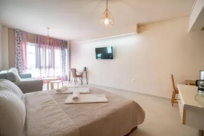 a bedroom with a bed with a towel on it at Monastiraki metro station studio for 4 pers by MPS in Athens