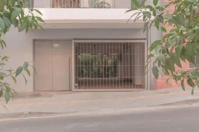 a garage door with a gate on the side of a building at Luxury Apartment near Acropolis-Living Stone Gold in Athens