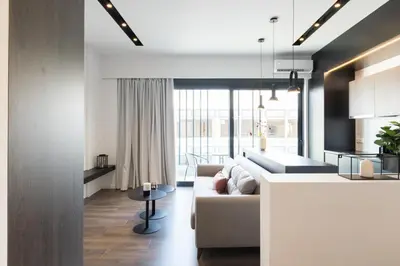 a living room with a couch and a table at Voda Luxury Residence #501 - Acropolis View Rooftop in Athens