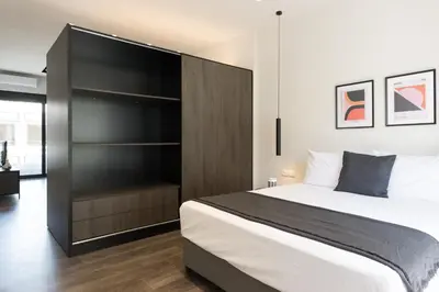 a bedroom with a large bed and a closet at Voda Luxury Residence #502 - Acropolis View Rooftop in Athens