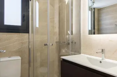 a bathroom with a toilet and a sink and a shower at Voda Luxury Residence #502 - Acropolis View Rooftop in Athens