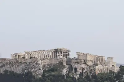 a view of the acropolis of athens from atop a mountain at Luxury Acropolis View Duplex Penthouse in Thiseio 155m2 in Athens