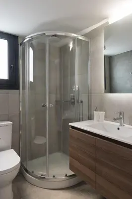 a bathroom with a shower and a sink and a toilet at Voda Luxury Residence Penthouse #602 - Acropolis View Rooftop in Athens
