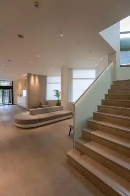 a lobby of a house with stairs and a couch at Emmantina Hotel in Athens