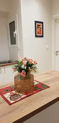 a bouquet of flowers in a basket on a table at B2 Acropolis in Athens