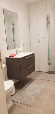 a bathroom with a toilet and a sink and a mirror at B2 Acropolis in Athens