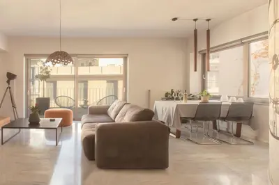 a living room with a couch and a table at Luxury Apt with Parking-Living Stone Silver in Athens