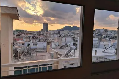 a view of a city from a window at Studio with panoramic Athens view in Athens