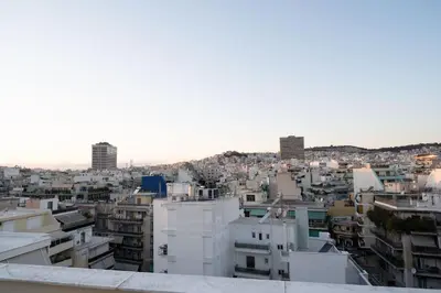 a view of a city from the roof of a building at Studio with panoramic Athens view in Athens