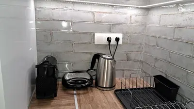 a kitchen counter with a coffee maker and a toaster at Studio with panoramic Athens view in Athens