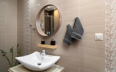 a bathroom with a sink and a mirror at Plaka Apartment With Terrace View in Athens