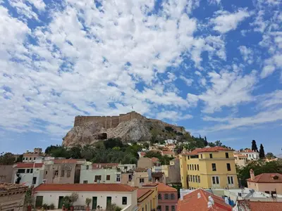 a view of the acropolis from the city at Plaka Apartment With Terrace View in Athens