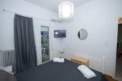 a room with a table with two towels on it at ΑΙΘΡΑ Suite in Athens