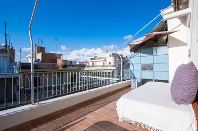 a balcony with a bed and a view of a city at Loft Apt with Acropolis View in Athens