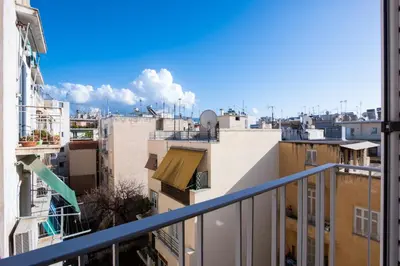 a view of the city from a balcony at Loft Apt with Acropolis View in Athens