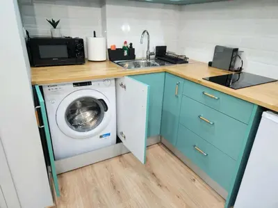 a kitchen with a washing machine and a sink at Victoria Suite VIPGreece in Athens
