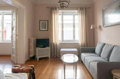 a living room with a couch and a table at Hadrians Den in Heart of Plaka by JJ Hospitality in Athens