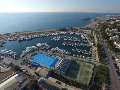 an aerial view of a marina with a pool at Palmyra Beach Hotel in Athens