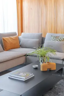 a living room with a couch and a coffee table at Foothills of Acropolis-Thissio 3 bdrm apartment in Athens