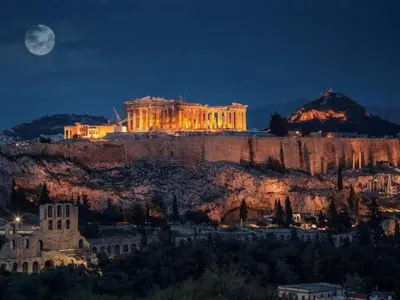 a view of the acropolis lit up at night at Foothills of Acropolis-Thissio 3 bdrm apartment in Athens