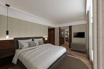 a bedroom with a large bed and a television at Athens Marriott Hotel in Athens